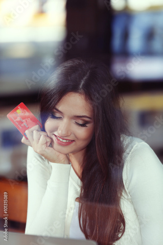 Young woman working with la...