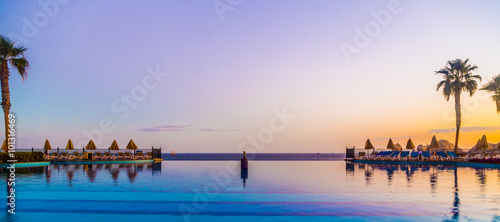 Obraz na płótnie Poolside View at a Luxury Beach Resort in Mexico