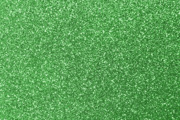 background shining uniformly colored green glitter