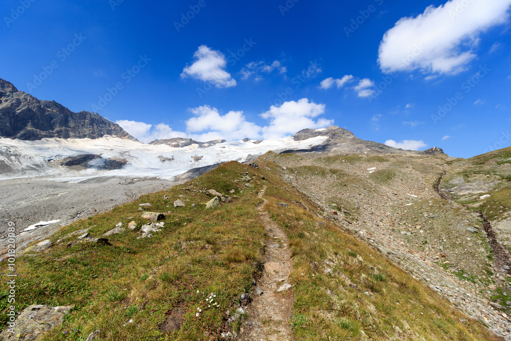 Footpath and glacier panorama with mountain Kristallwand in Hohe Tauern Alps, Austria