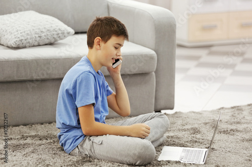 Boy with mobile phone and l...