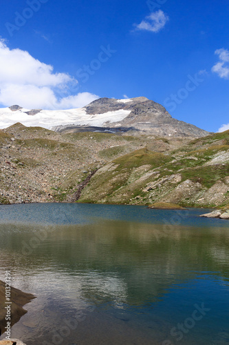 Lake and glacier panorama with mountain Kristallwand in Hohe Tauern Alps, Austria