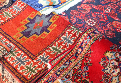 many ancient colored wool carpets made by hand in the Middle Eas