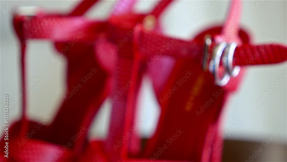 red elegant female shoes with two rings on them red elegant female shoes with two rings on them