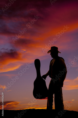 silhouette of man with guitar hold