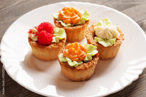 Four cake basket on a white plate