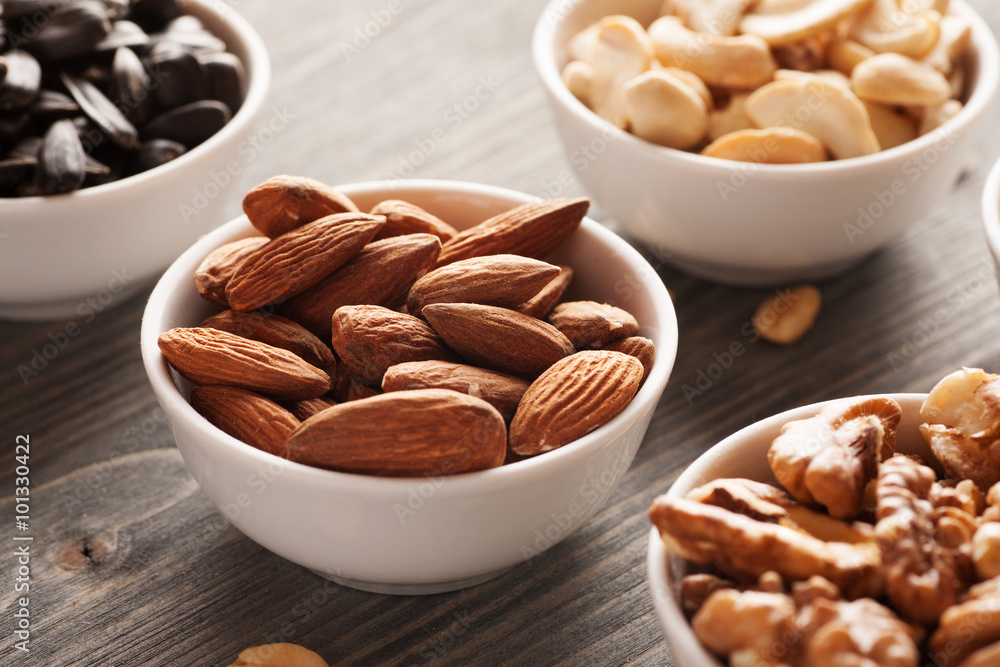 Nuts in white bowls close-up Nuts in white bowls close-up