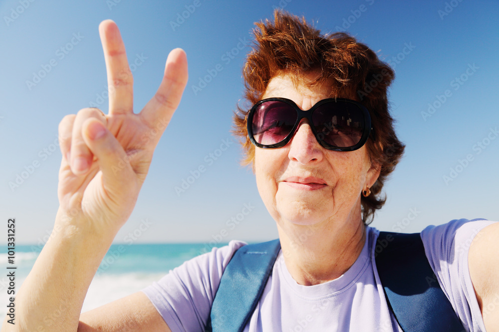 Selfie portait of happy senior woman on the beach Selfie portait of happy senior woman on the beach