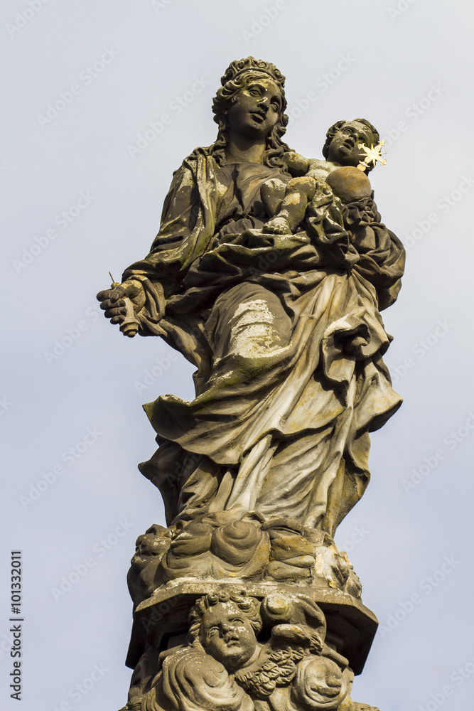 Statue of Madonna and St. Bernard at Charles bridge in Prague