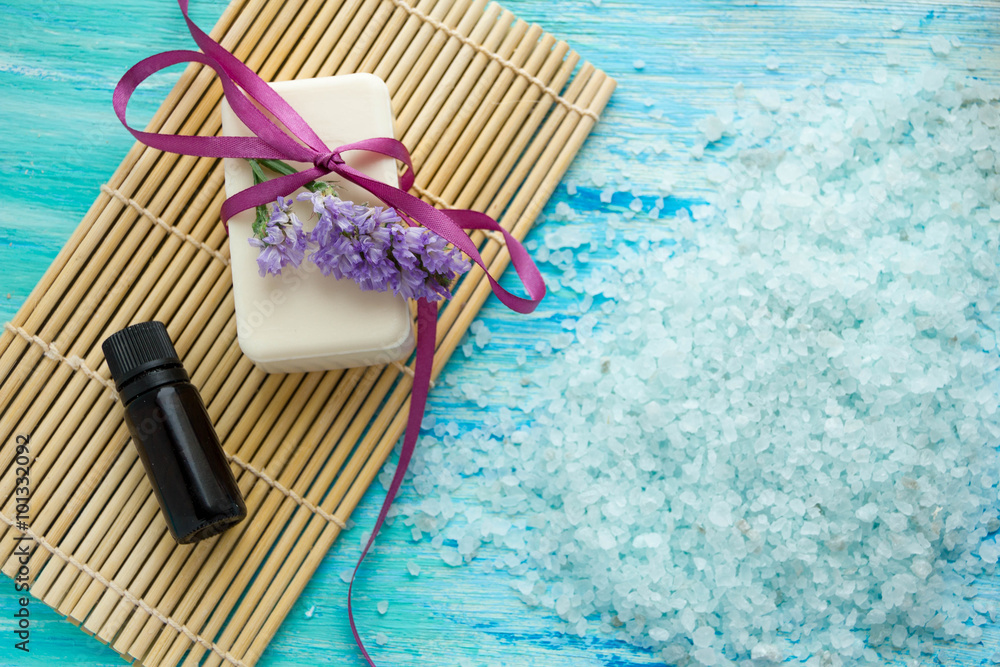 natural organic soap bottles essential oil and sea salt on a blue wooden table, Spa with natural organic soap bottles essential oil and sea salt on a blue wooden table, Spa with
