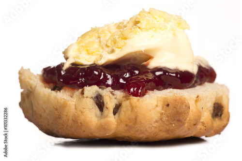Dorset scone with clotted cream on top photo