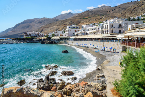 Bay with small beach in centre of Chora Sfakion town, Crete photo