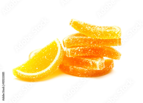 Fruit jelly slices in sugar on a white background photo