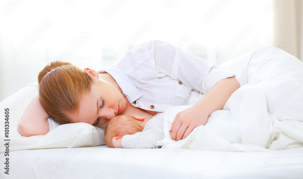 sleeping together and breastfeeding mother and newborn baby in b sleeping together and breastfeeding mother and newborn baby in b