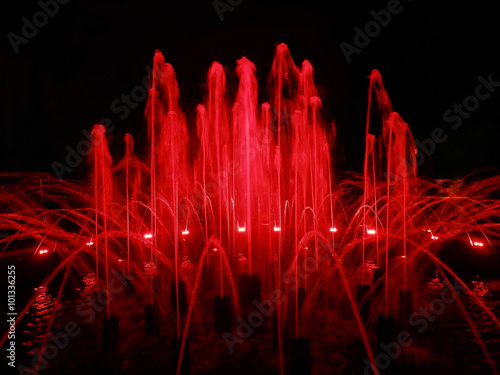 A beautiful fountain with red illumination