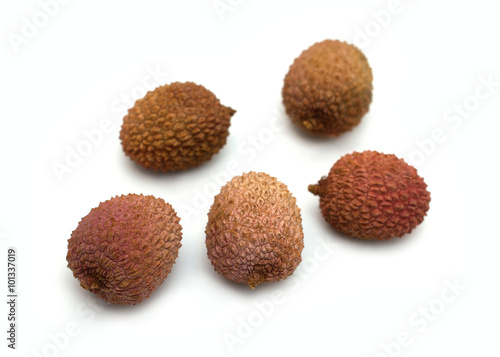 Five ripe litchi fruits isolated on white background closeup
