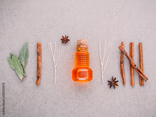 Obraz na plátně Bottle of essential oil with cinnamon stick ,star anise ,bay lea