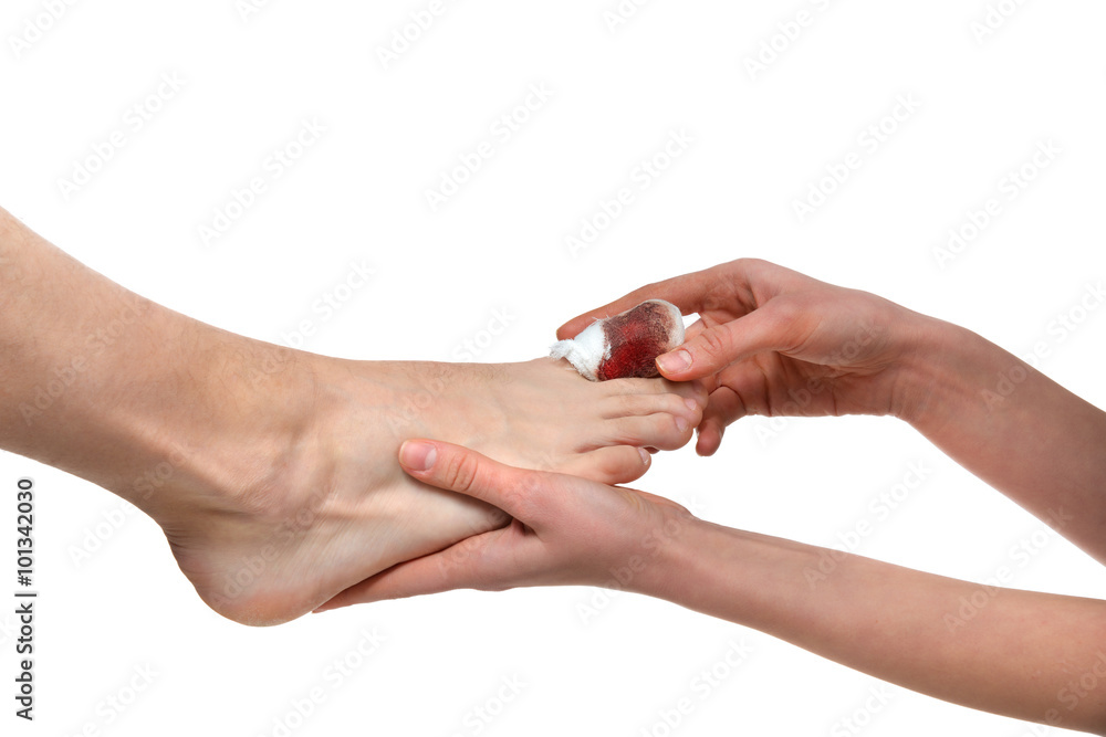 Doctor hands treat mens leg with икщлут blood bandaged pai Doctor hands treat mens leg with икщлут blood bandaged pai