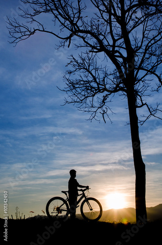 Boy riding bicycle silhouette