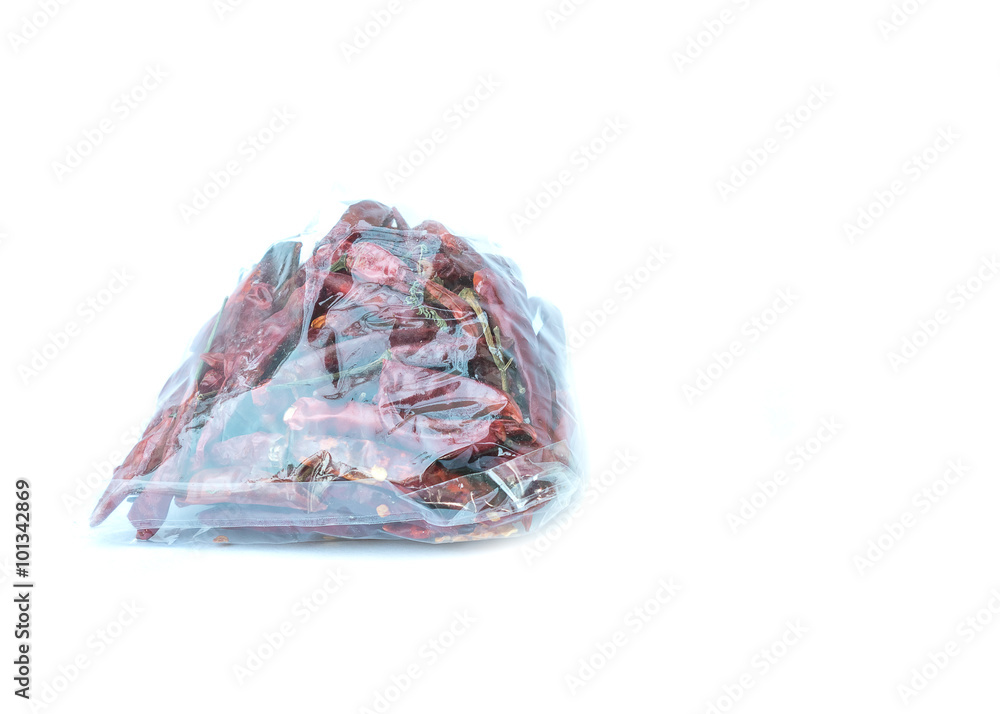chillies inside a plastic bag on white background chillies inside a plastic bag on white background