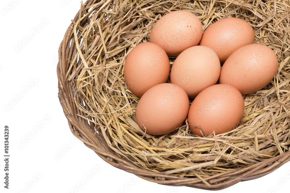 eggs on straw on wicker basket isolated and include path eggs on straw on wicker basket isolated and include path