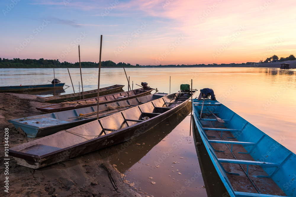 Boats on the Mekong River at sunset
