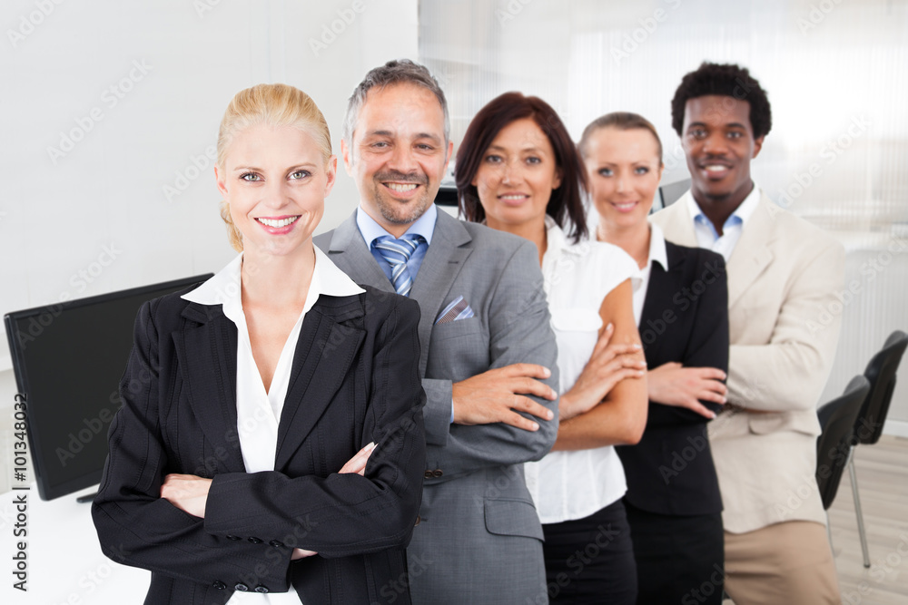 Multiethnic Team With Arms Crossed Smiling In Office Multiethnic Team With Arms Crossed Smiling In Office