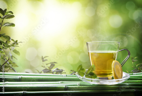 Oriental green tea with mint and lemon on bamboo front