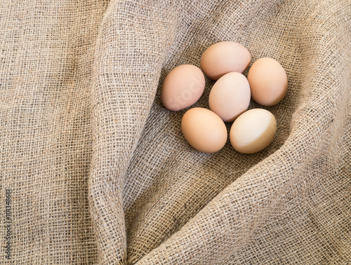 Fresh farm eggs on sackcloth ( Space for Text )