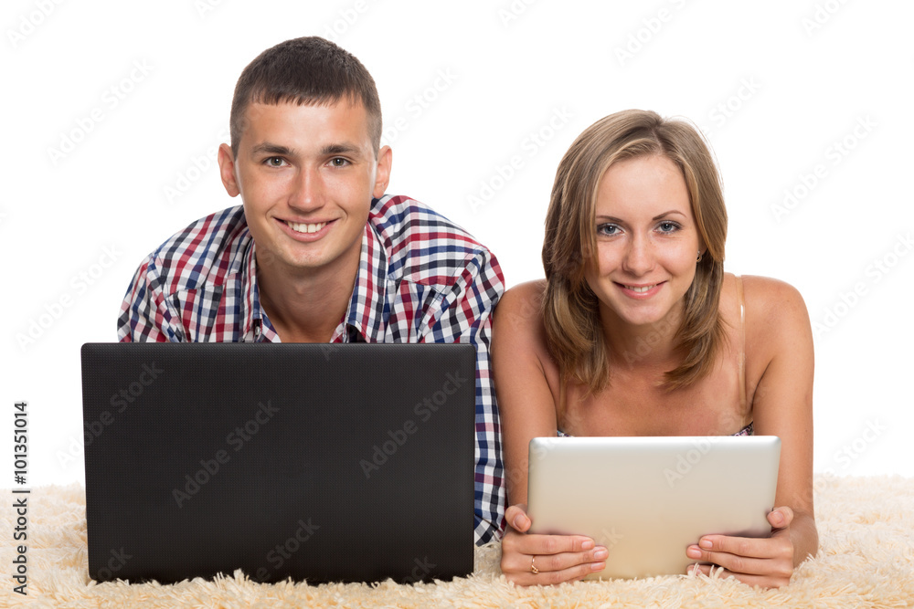 Woman and man with a laptop and tablet PC