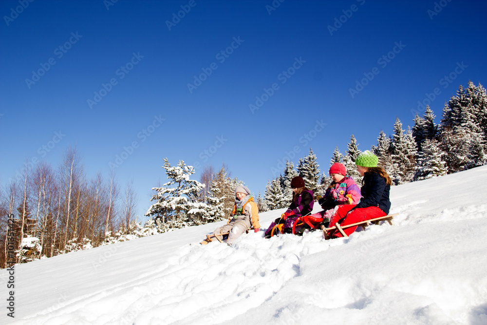 Fototapeta premium Happy children in winter. Children playing on the snow. Children