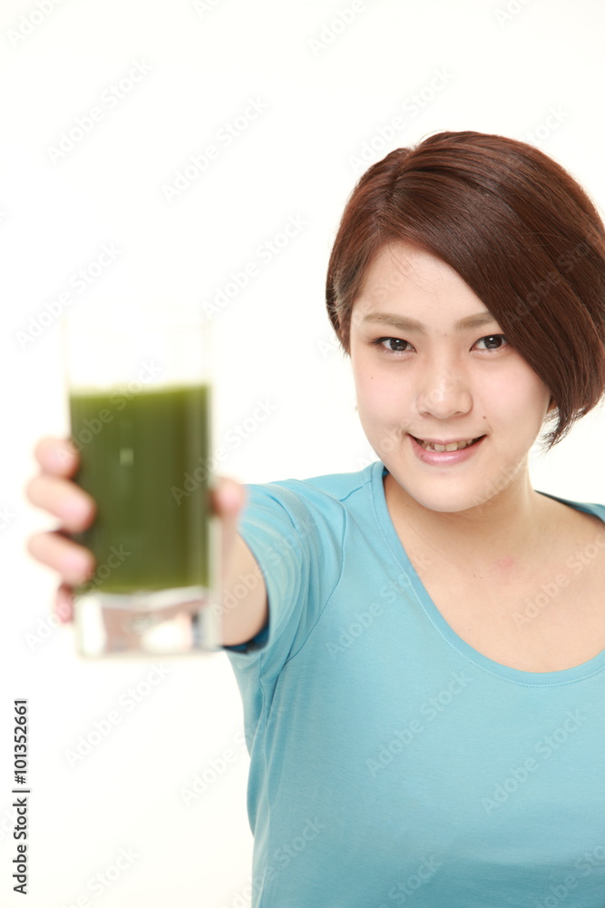 Japanese woman with fresh green vegetable juice Japanese woman with fresh green vegetable juice