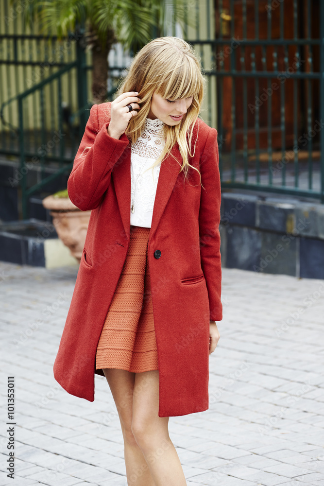 Beautiful model in red coat, looking down Beautiful model in red coat, looking down
