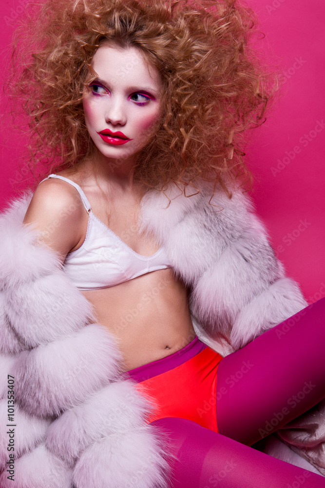Portrait of young sensual woman with curly hair and fashion clown make-up. Fashin Clown. Portrait of young sensual woman with curly hair and fashion clown make-up. Fashin Clown.