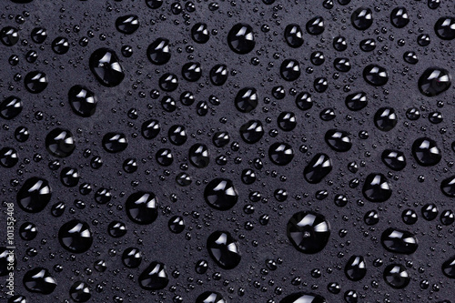 water drops on a black plastic surface
