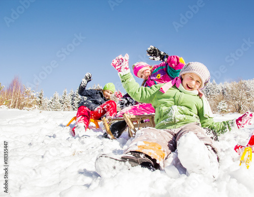 Happy children  at winter time. Group of children spending a nice time in snow
