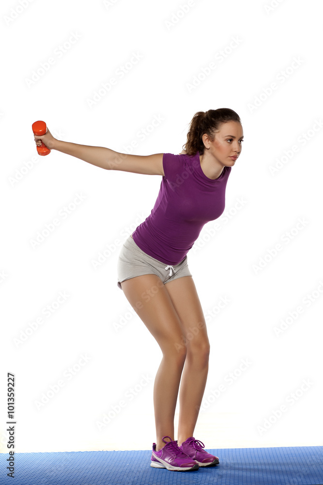 beautiful girl doing fitness exercise with weight