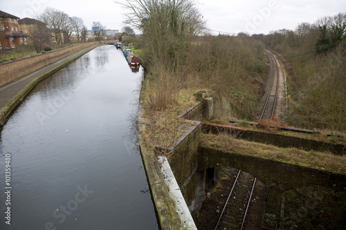 Three Bridges. Designed by Isambard Kingdom Brunel in the 19th century, the three bridges junction has a railway line going under a canal going under a road. photo