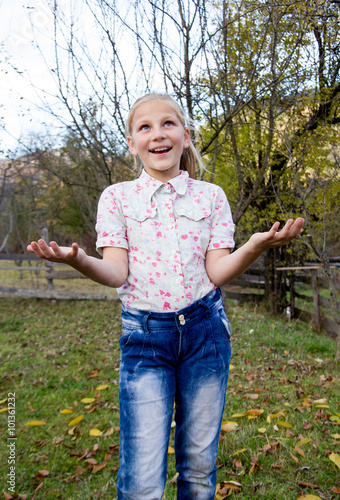 Adorable little girl in autumn day