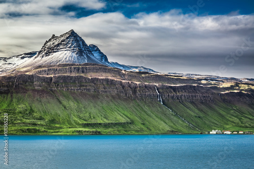 Volcanic mountain over fjor...