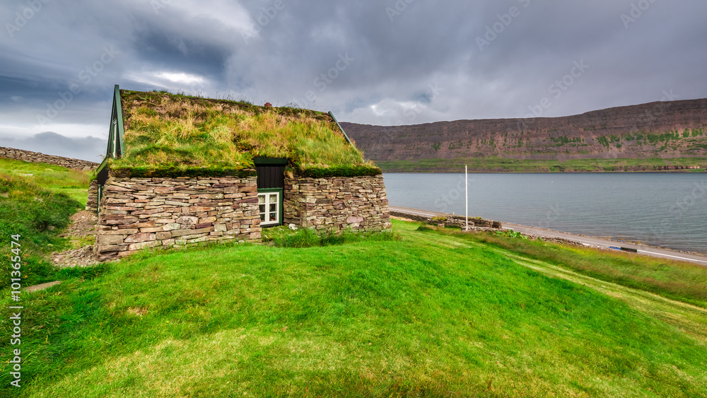 Cottage covered with grass on the roof in Iceland