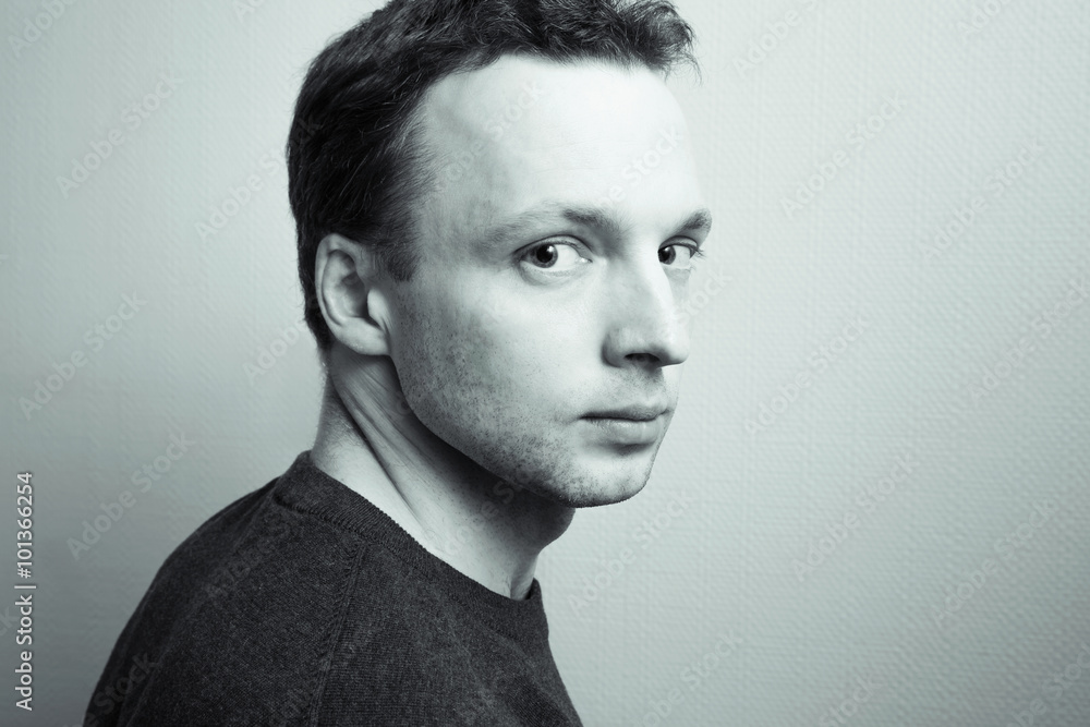 Young serious man studio portrait, green toned Young serious man studio portrait, green toned
