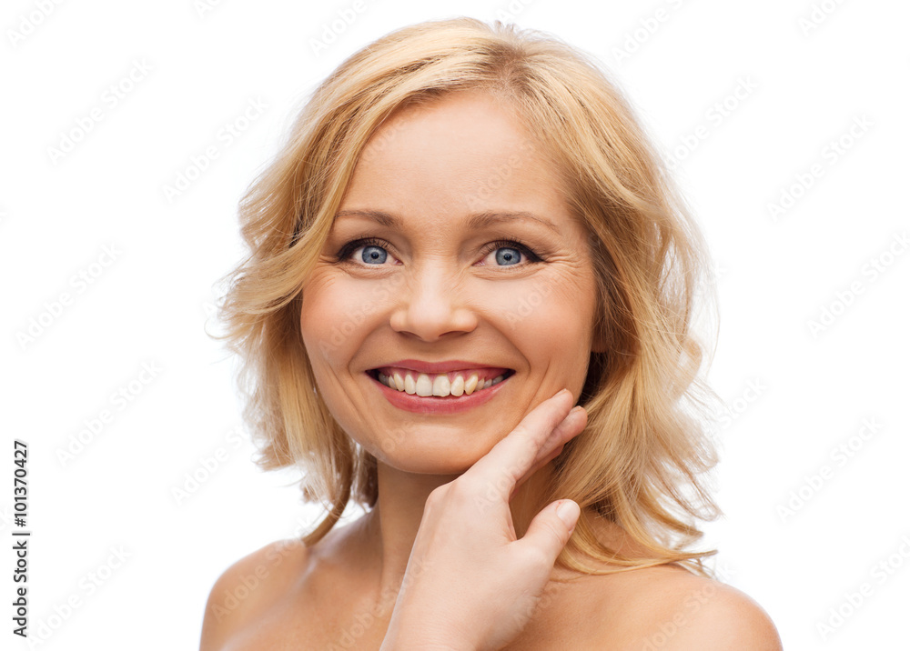 smiling woman with bare shoulders touching face smiling woman with bare shoulders touching face