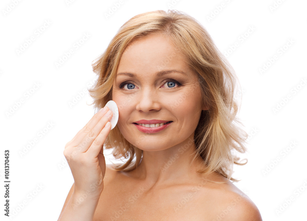 happy woman cleaning face with cotton pad happy woman cleaning face with cotton pad