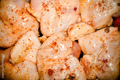 Chicken with spices fried in a pan. Toned