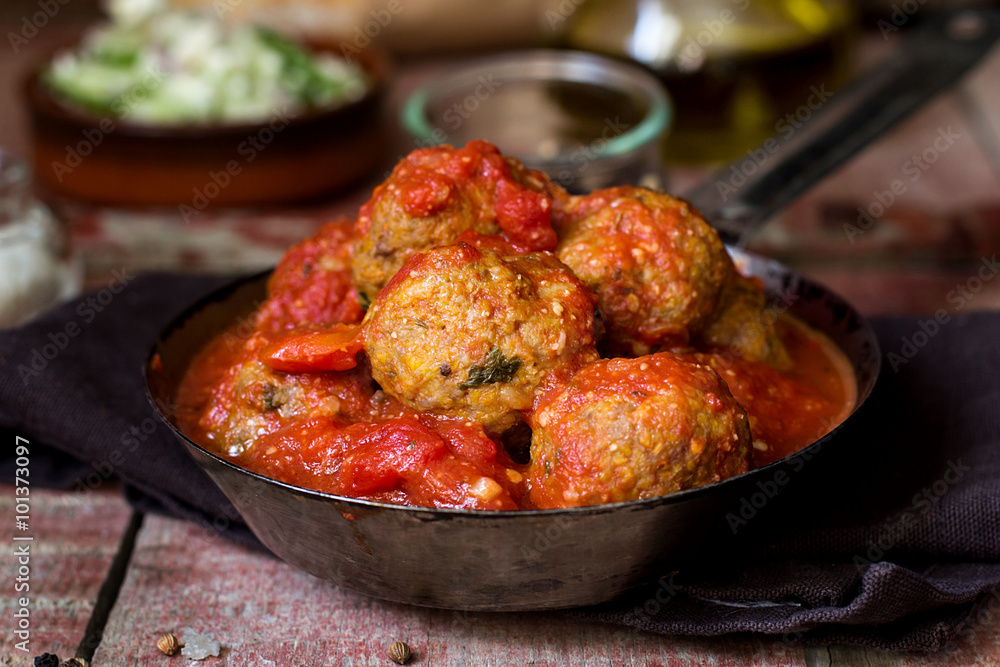 Meatballs with ground pumpkin in tomato sauce