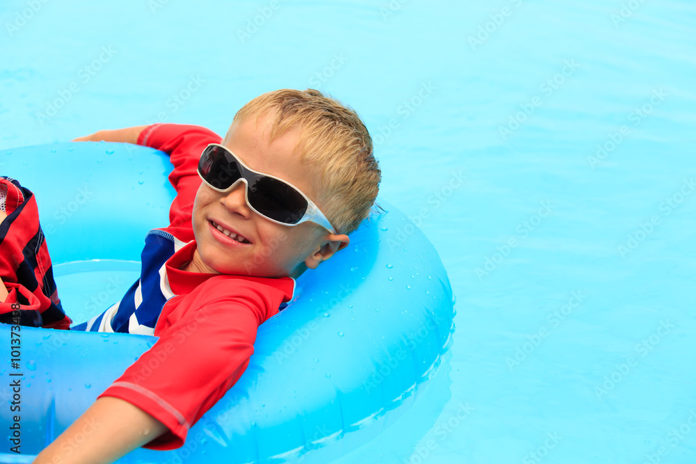 little boy having fun in swimming pool
