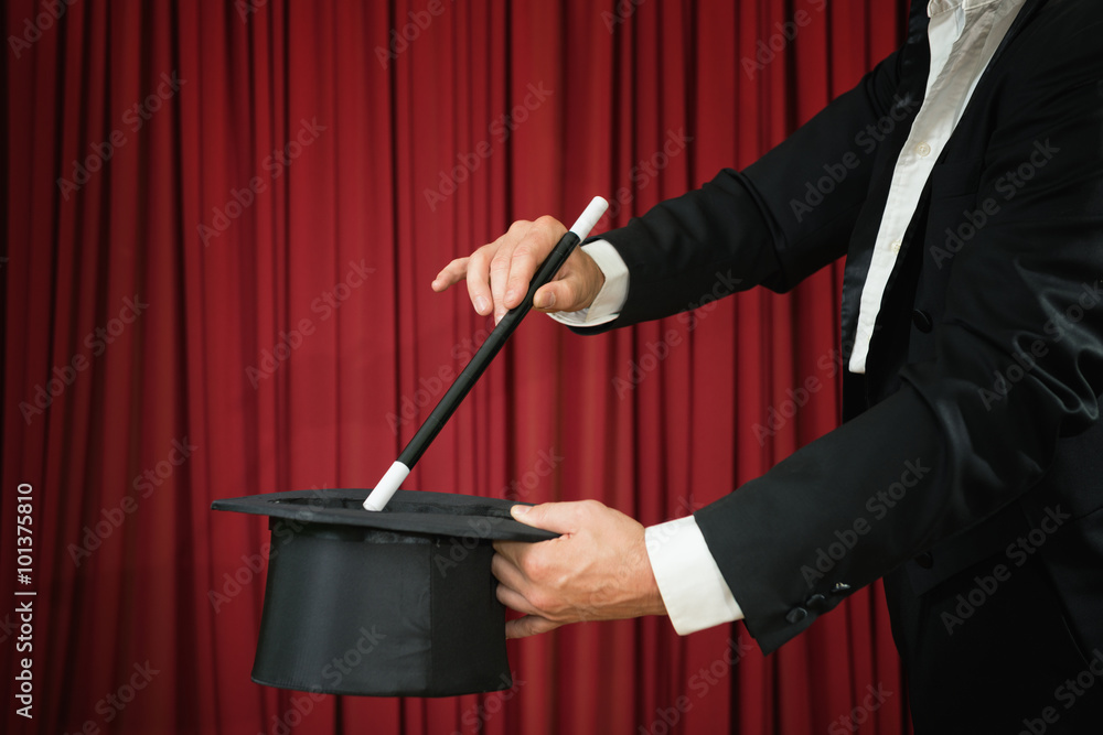 Εκτύπωση καμβά Magician with top hat and magic wand performing on stage
