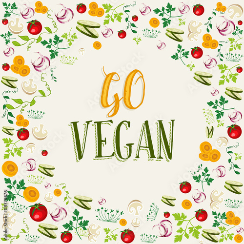 Raw vegetable background with go vegan text