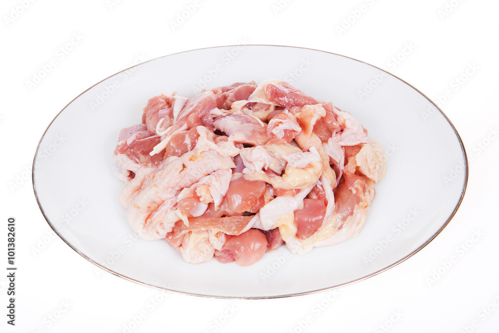 Chicken, cut into pieces on a white background.